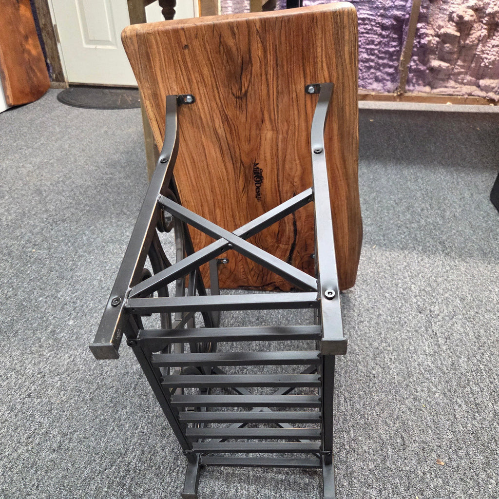bottom view Hickory End Table with beautiful live edge sitting on metal basket style base.