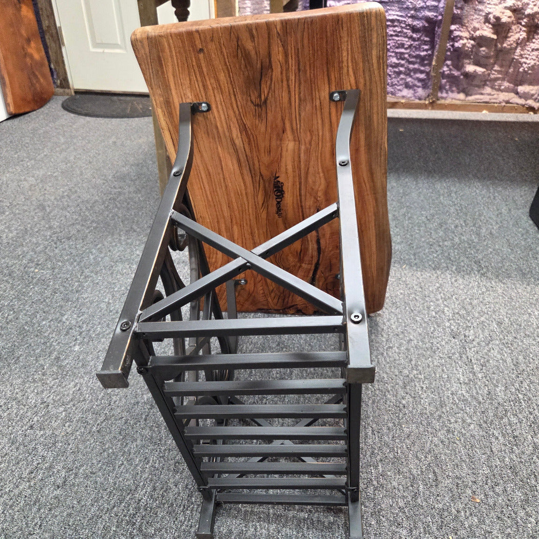 bottom view Hickory End Table with beautiful live edge sitting on metal basket style base.