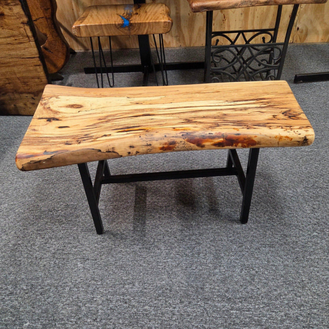 Elm Coffee table with live edges on black metal tube legs system