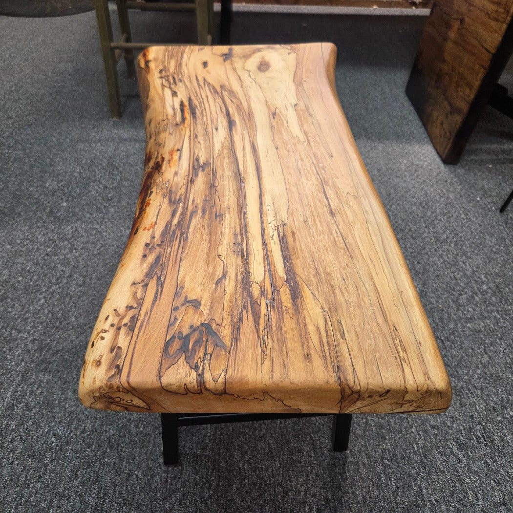 Elm Coffee table with live edges on black metal tube legs system