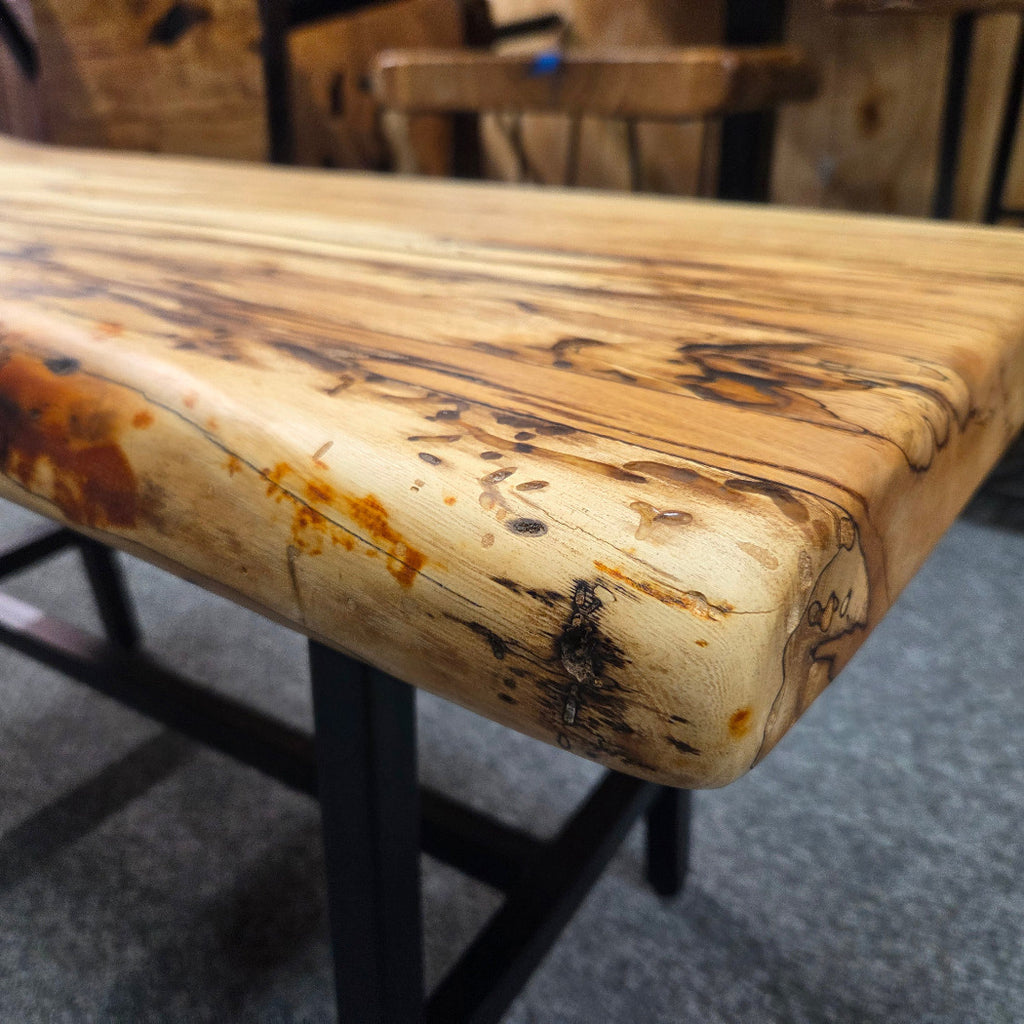 Elm Coffee table with live edges on black metal tube legs system