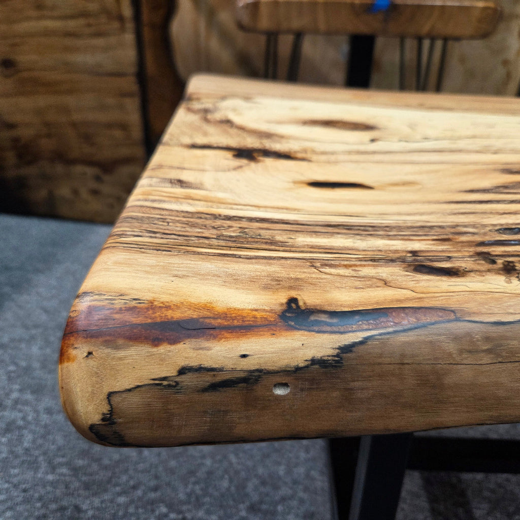 Elm Coffee table with live edges on black metal tube legs system