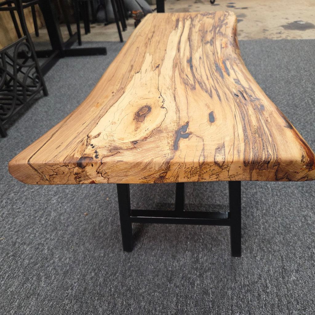 Elm Coffee table with live edges on black metal tube legs system