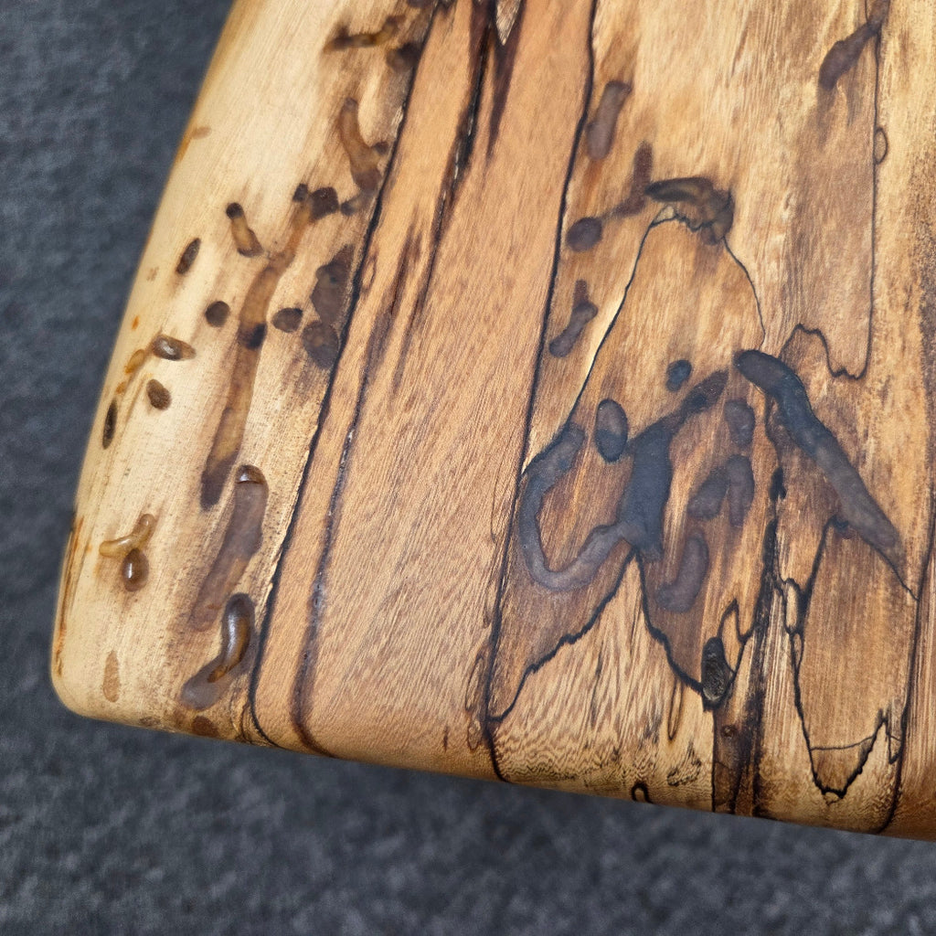 Elm Coffee table with live edges on black metal tube legs system