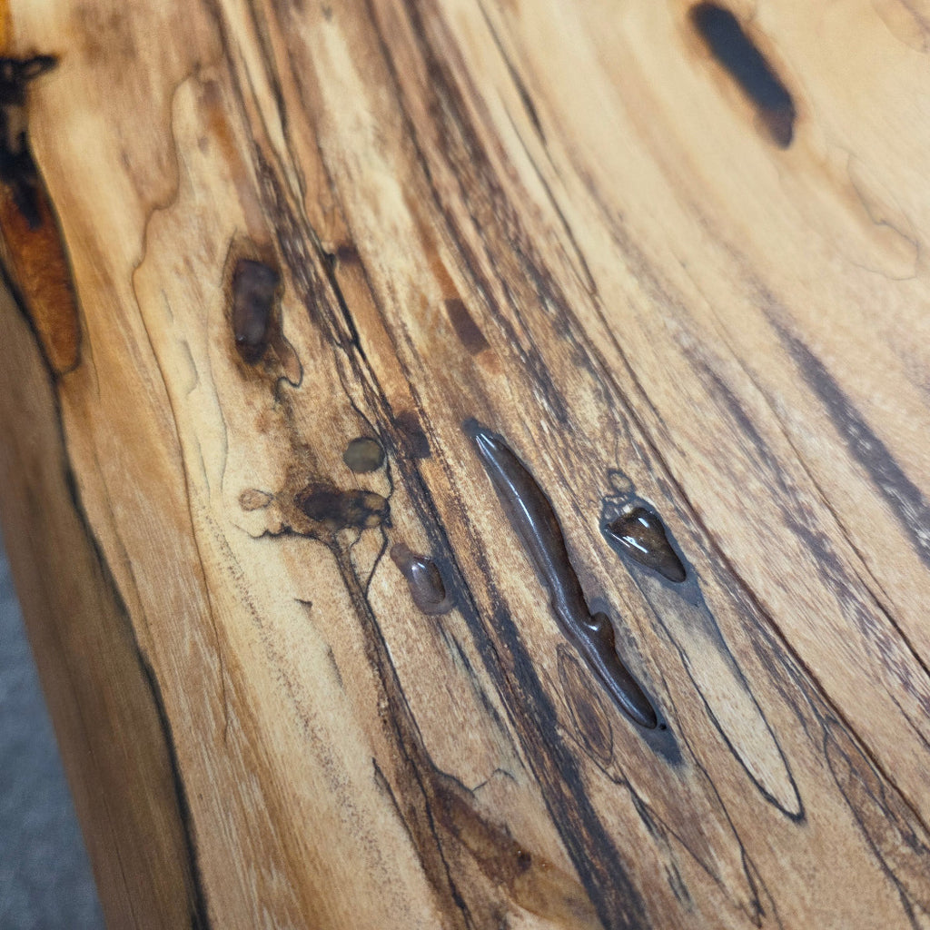 Elm Coffee table with live edges on black metal tube legs system