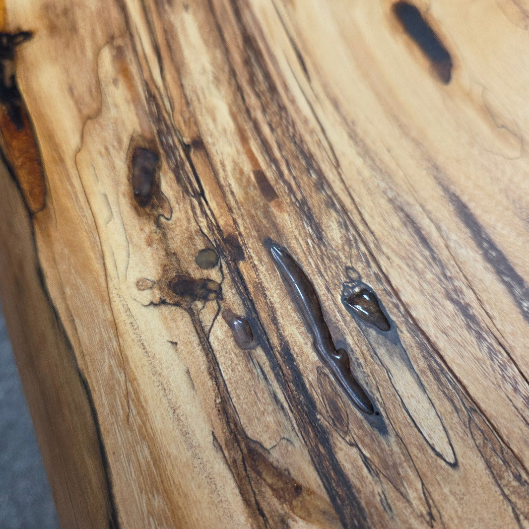 Elm Coffee table with live edges on black metal tube legs system