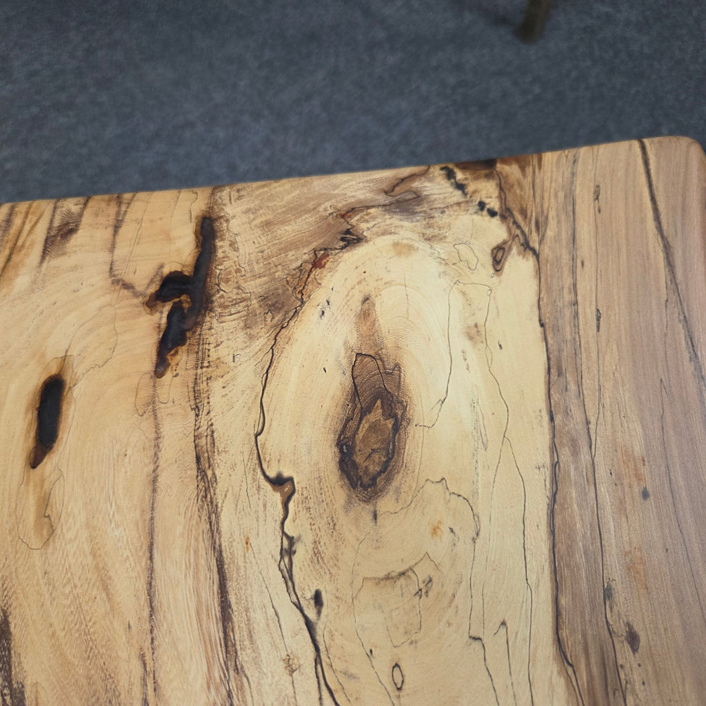 Elm Coffee table with live edges on black metal tube legs system