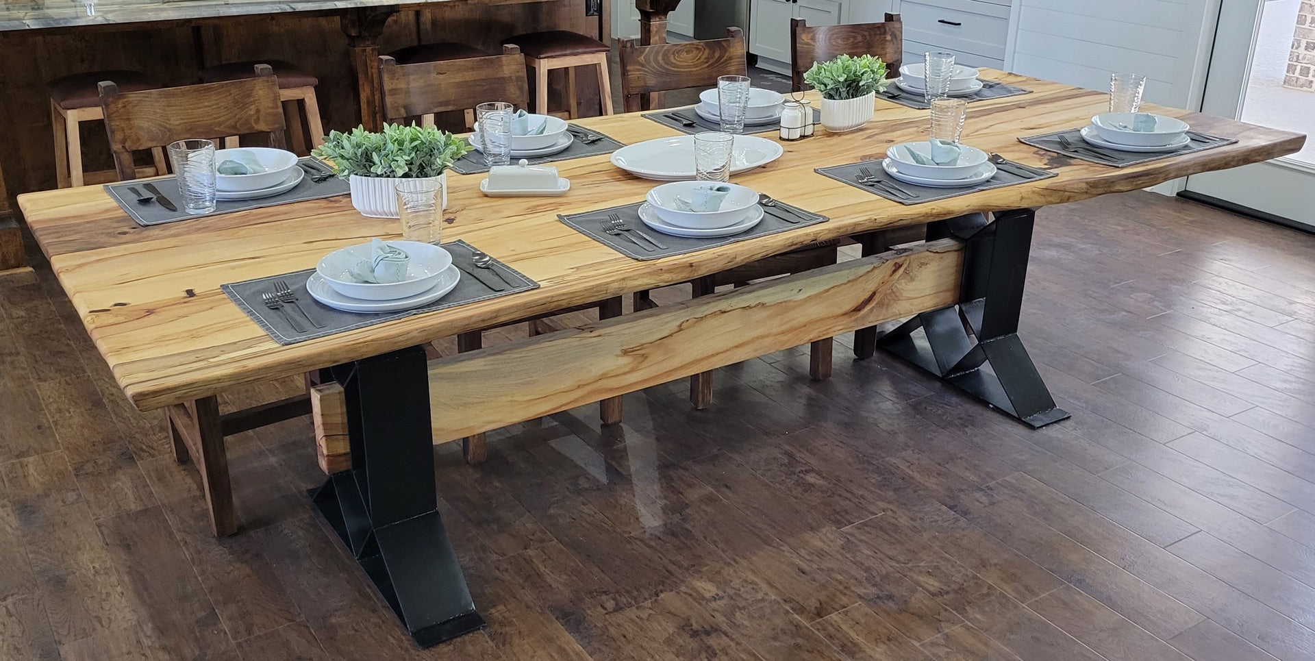 Large Elm Dining Table with geometric legs with elm beam crossing from one to the other.