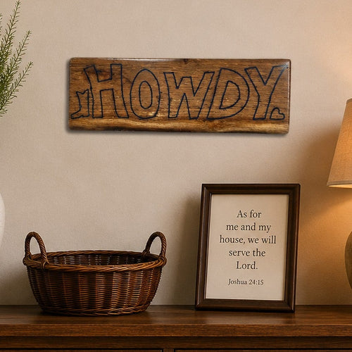 "Handcrafted wooden HOWDY wall sign with blue epoxy accents displayed above a rustic console table in a warm farmhouse entryway."