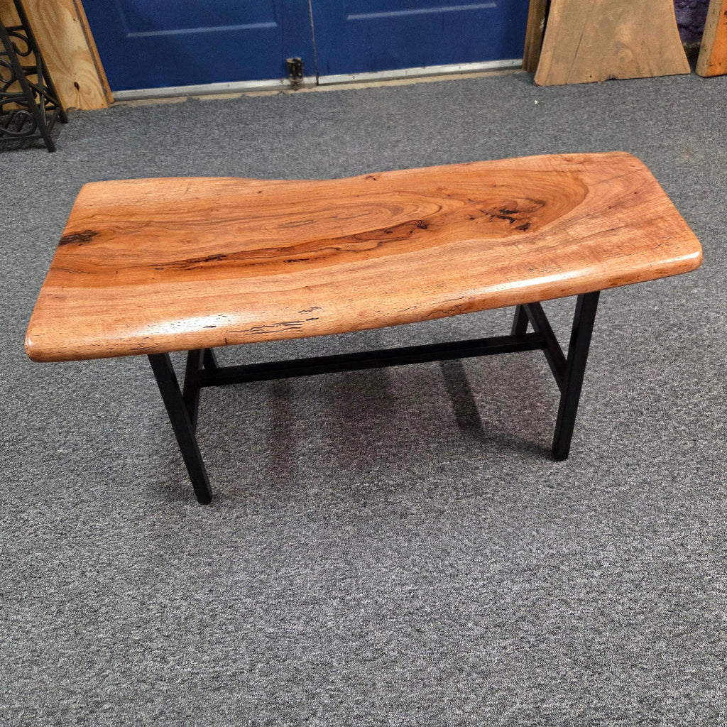 Handcrafted live edge pecan coffee table with Honey Oak stain and black steel legs