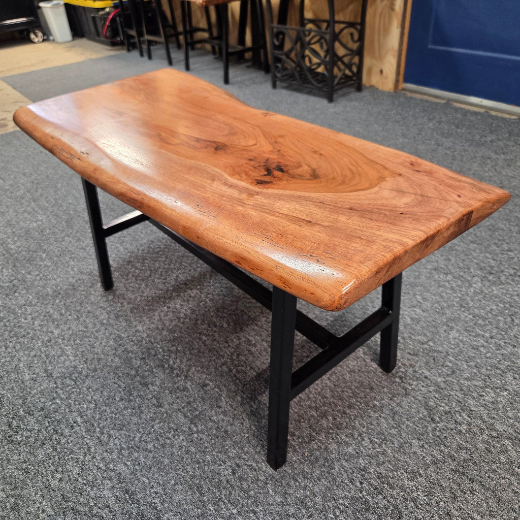 Handcrafted live edge pecan coffee table with Honey Oak stain and black steel legs