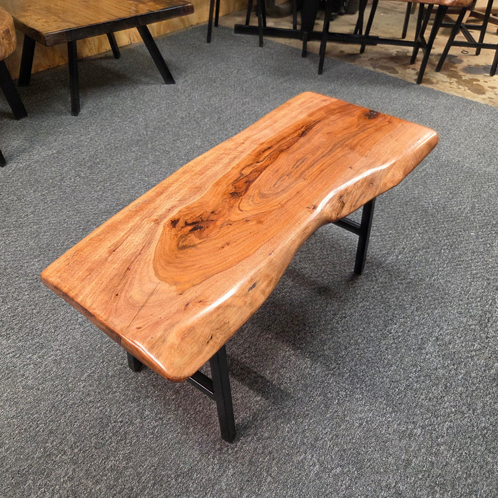 Handcrafted live edge pecan coffee table with Honey Oak stain and black steel legs