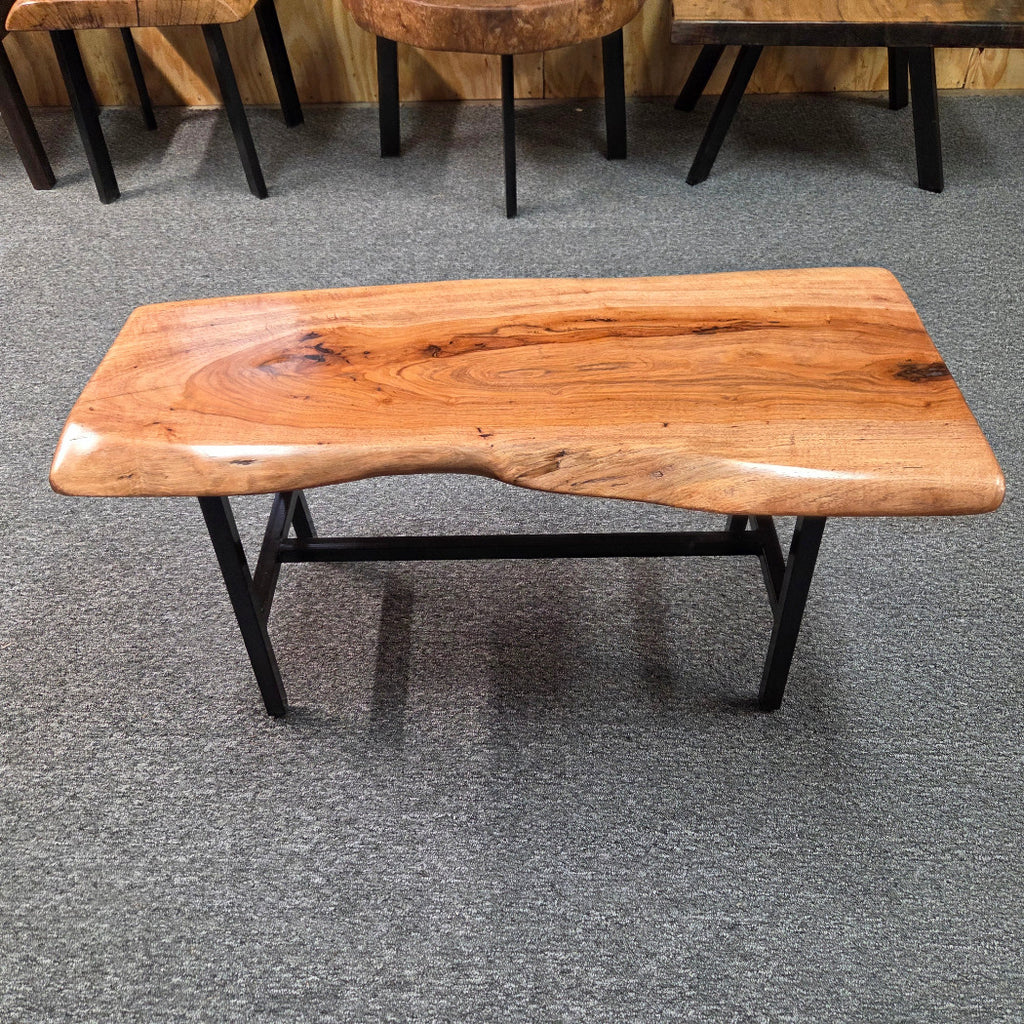 Handcrafted live edge pecan coffee table with Honey Oak stain and black steel legs