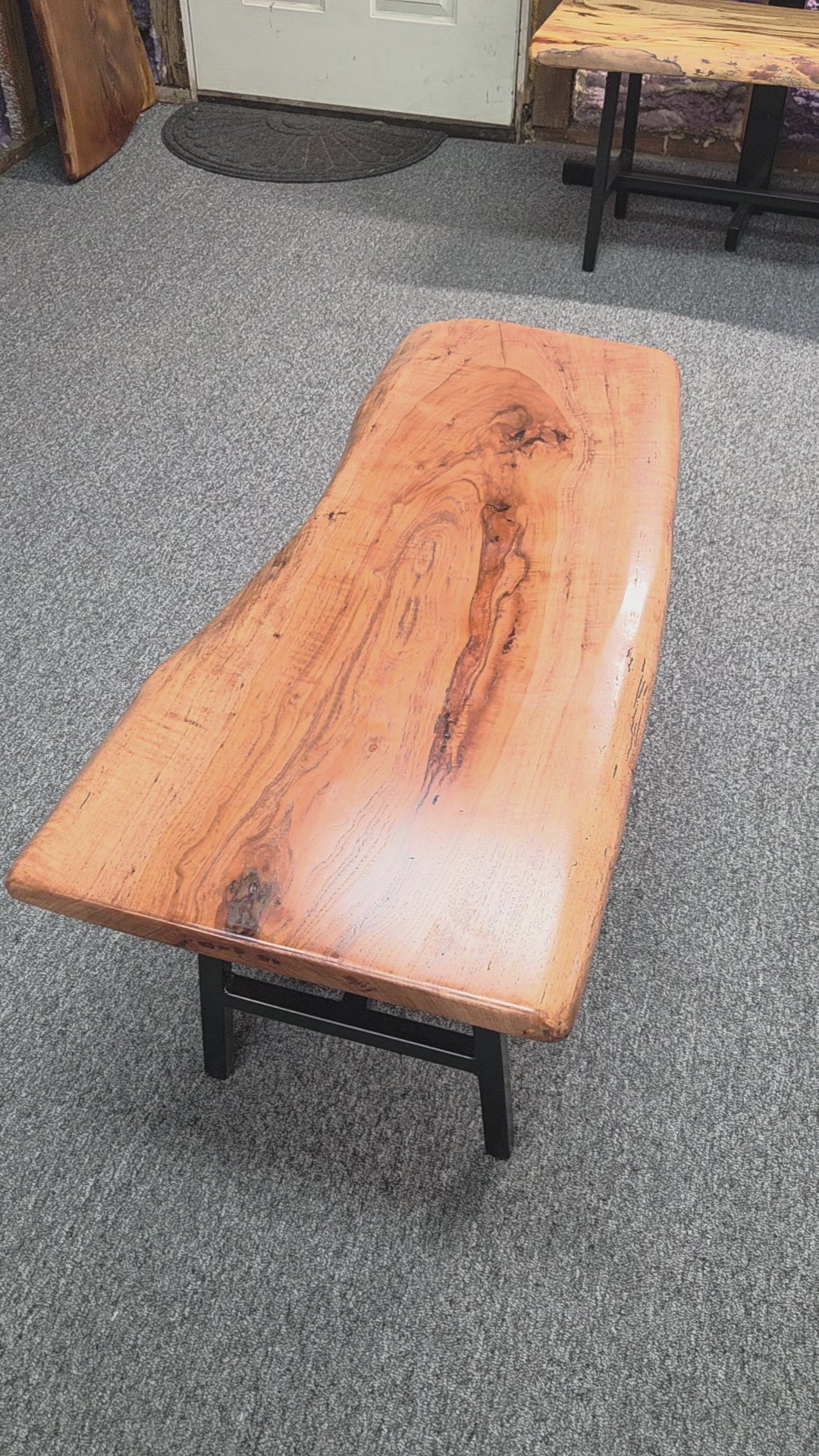 Handcrafted live edge pecan coffee table with Honey Oak stain and black steel legs