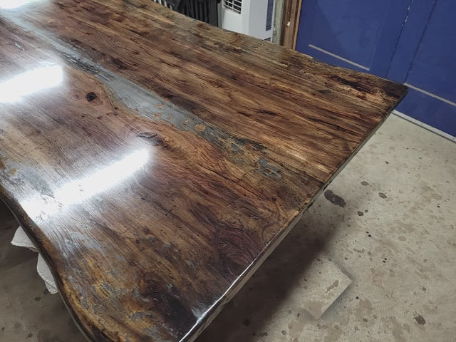 Rustic Pecan Live edge dining table with dark stain and semi-gloss finish.