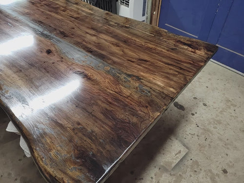 Rustic Pecan Live edge dining table with dark stain and semi-gloss finish.