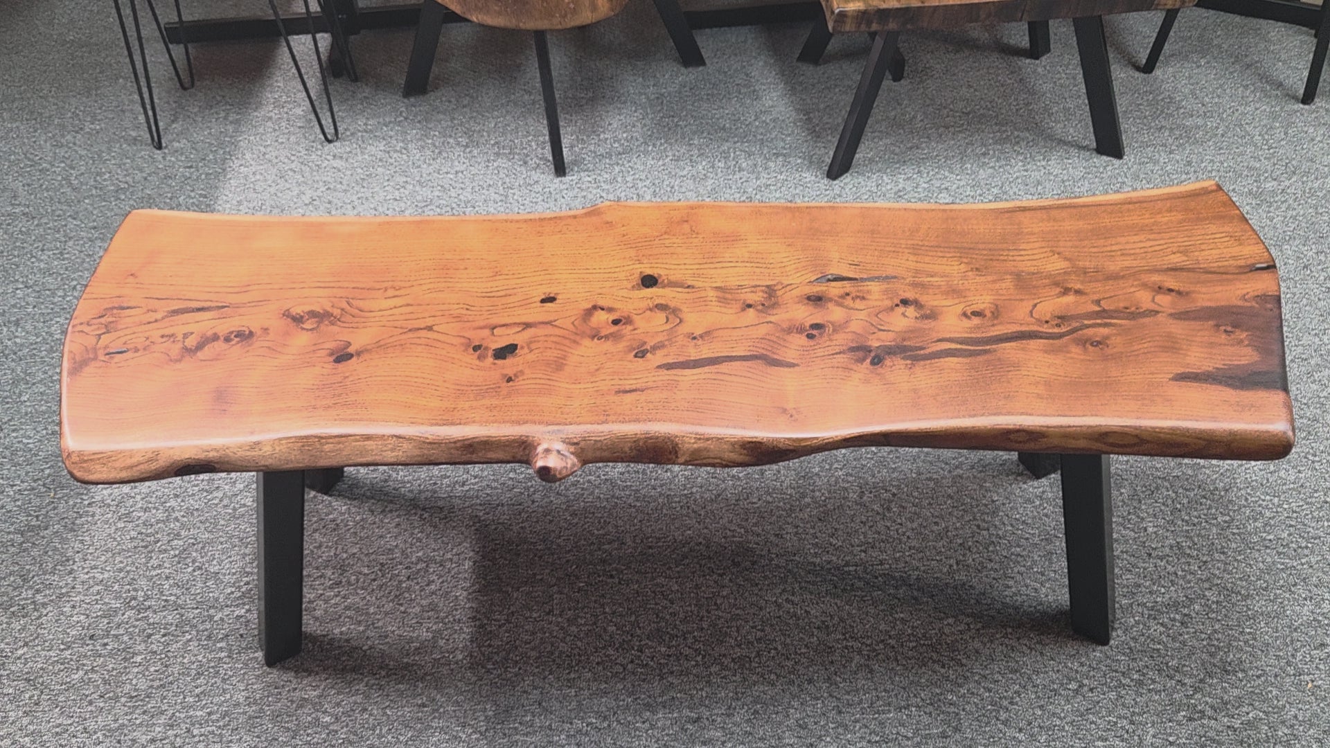 beautiful Bois D'Arc Bench Live edge rustic with black metal legs.