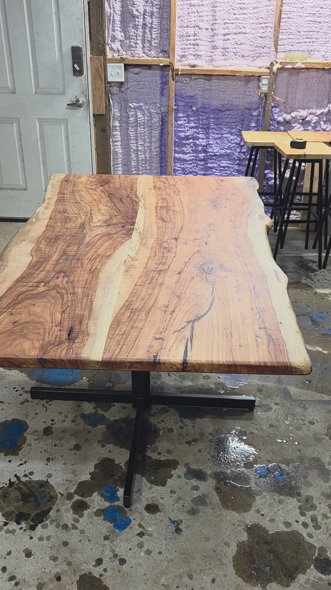 Live edge Pecan Breakfast table with black metal pedestal stand in natural color.