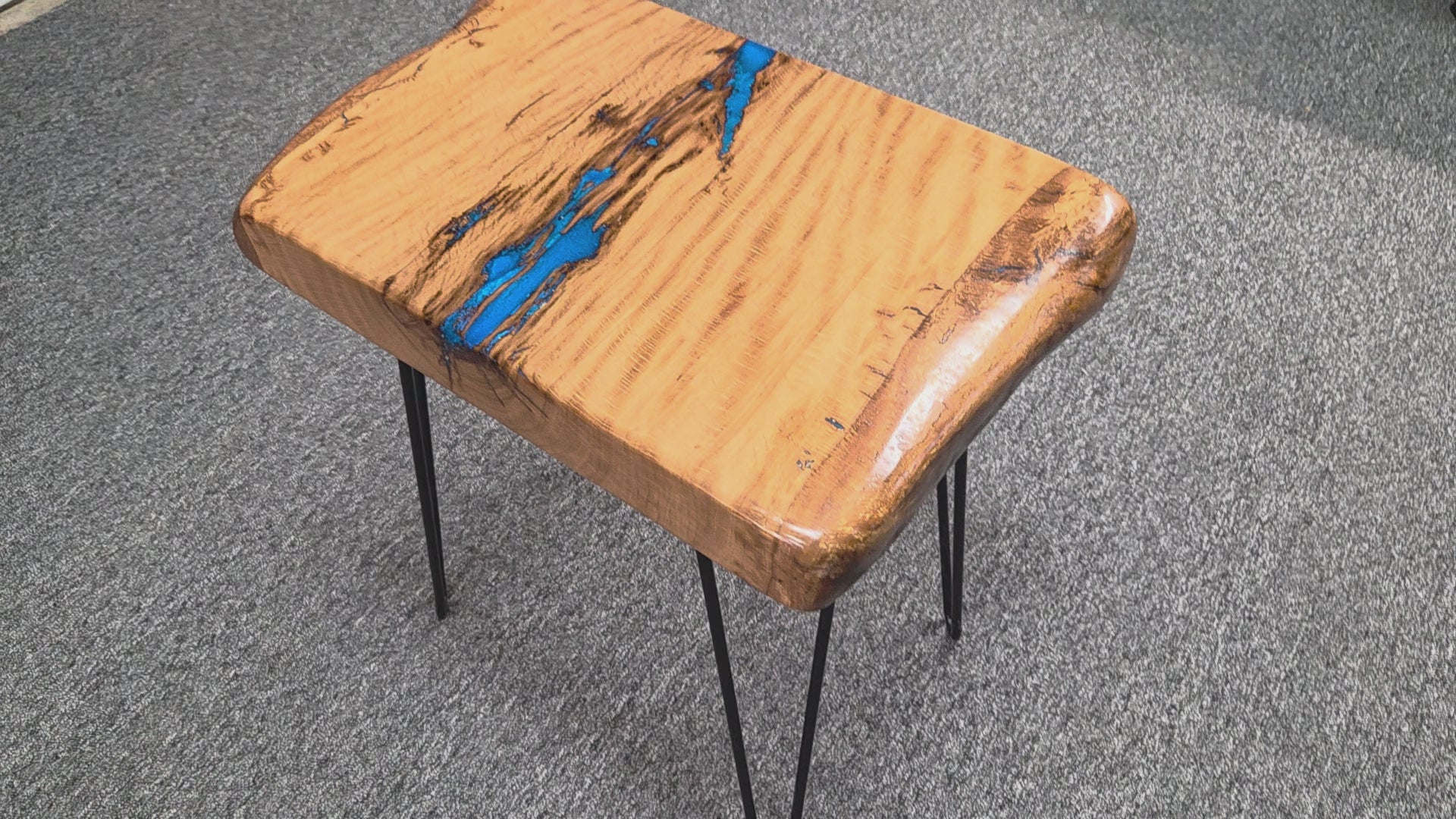 Live oak End table featuring live edge sides with blue epoxy inlay on black hair pin legs